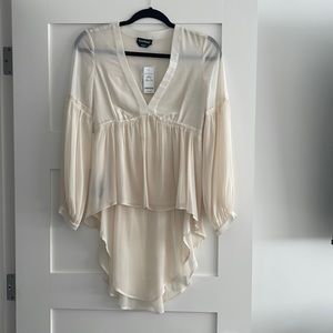 Bebe asymmetrical cream log sleeve shirt